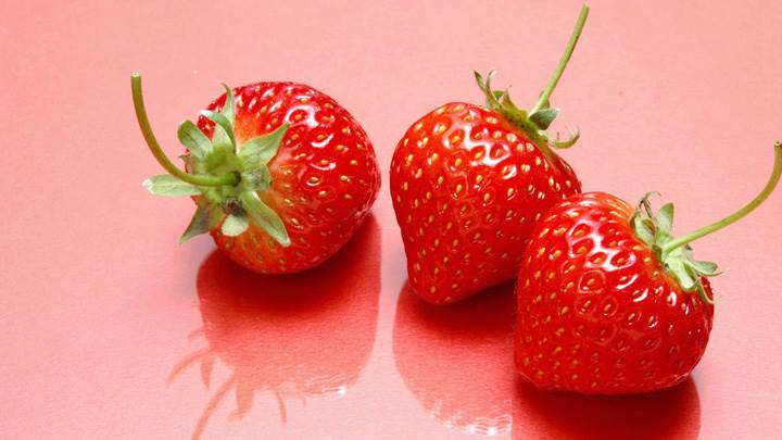 Fresh Strawberries And Pink Background